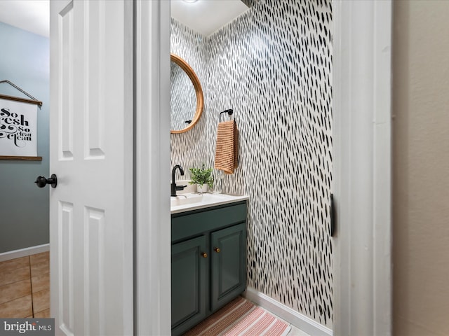1549 N Jefferson Ct, Lancaster, PA 17602 - bathroom featuring wallpapered walls, vanity, baseboards, tile patterned flooring, and an accent wall