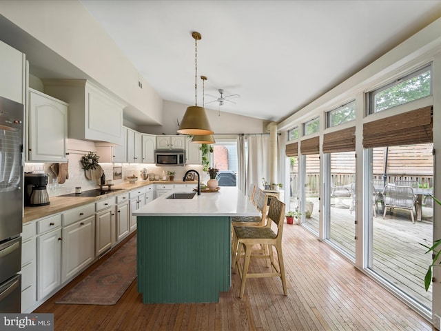 1549 N Jefferson Ct, Lancaster, PA 17602 - kitchen featuring ceiling fan, stainless steel microwave, a center island with sink, light countertops, and a sink