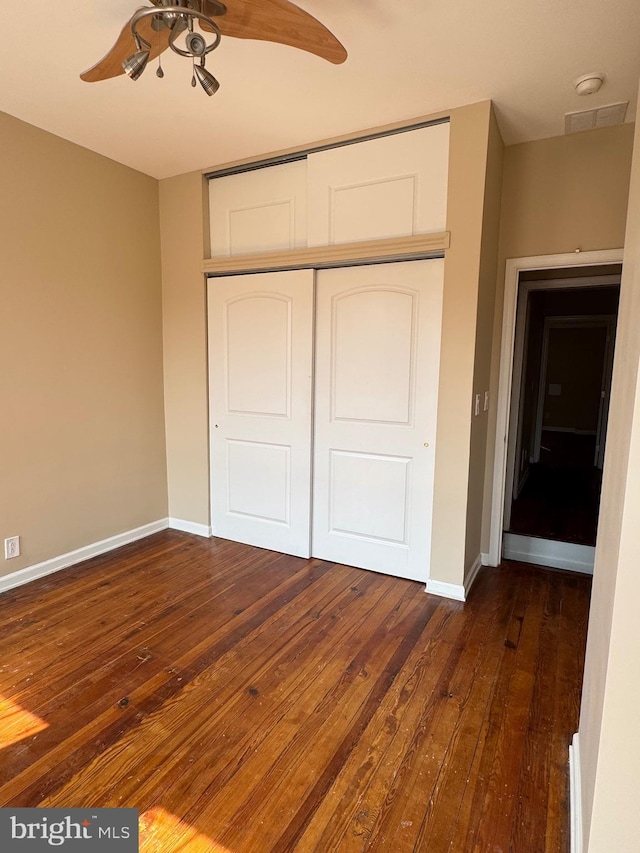 1406 Clarkson St, Baltimore, MD 21230 - unfurnished bedroom with dark wood finished floors, a closet, and ceiling fan