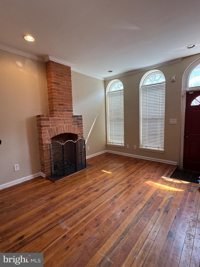 1406 Clarkson St, Baltimore, MD 21230 - unfurnished living room featuring hardwood / wood-style floors, a fireplace, ornamental molding, and recessed lighting