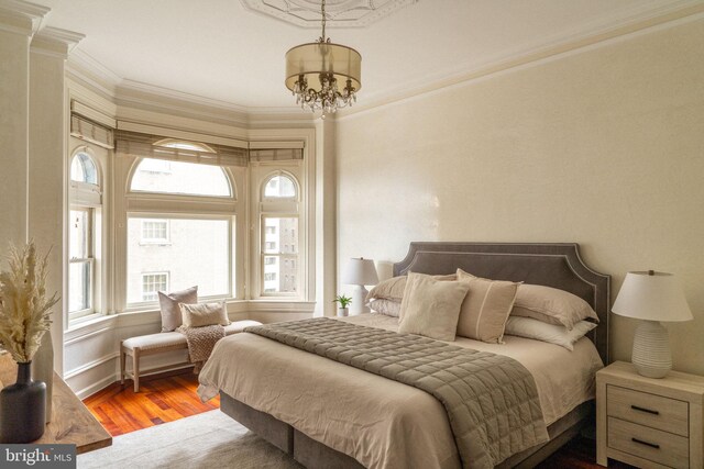 1830 Rittenhouse Sq Unit 11C, Philadelphia, PA 19103 - bedroom with wood finished floors, ornamental molding, and a chandelier