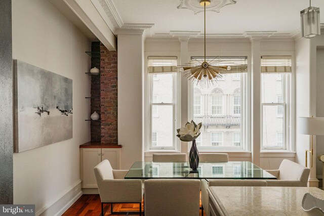 1830 Rittenhouse Sq Unit 11C, Philadelphia, PA 19103 - dining room with crown molding, dark wood-style flooring, healthy amount of natural light, baseboards, and a chandelier