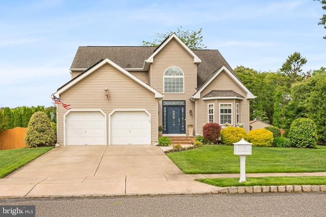 129 Bridle Path Dr, Egg Harbor Township, NJ 08234 - traditional-style home with concrete driveway, a shingled roof, and an attached garage