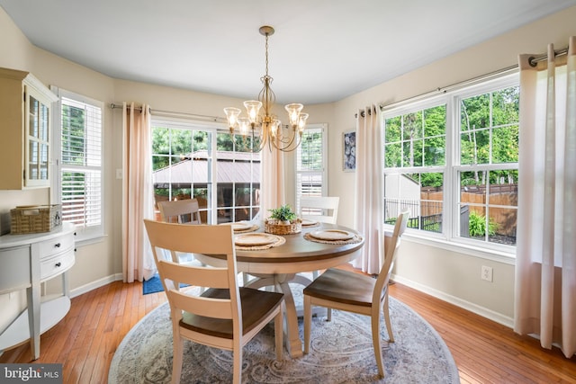 129 Bridle Path Dr, Egg Harbor Township, NJ 08234 - dining area with baseboards, a chandelier, and light wood-style floors