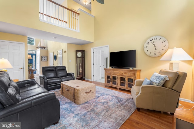 129 Bridle Path Dr, Egg Harbor Township, NJ 08234 - living room with wood finished floors, a high ceiling, and baseboards