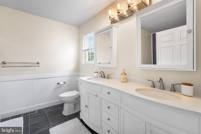 129 Bridle Path Dr, Egg Harbor Township, NJ 08234 - bathroom with double vanity, wainscoting, toilet, and tile patterned floors