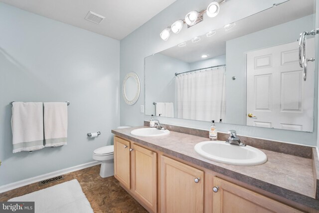 129 Bridle Path Dr, Egg Harbor Township, NJ 08234 - full bath featuring double vanity, toilet, baseboards, and a shower with shower curtain