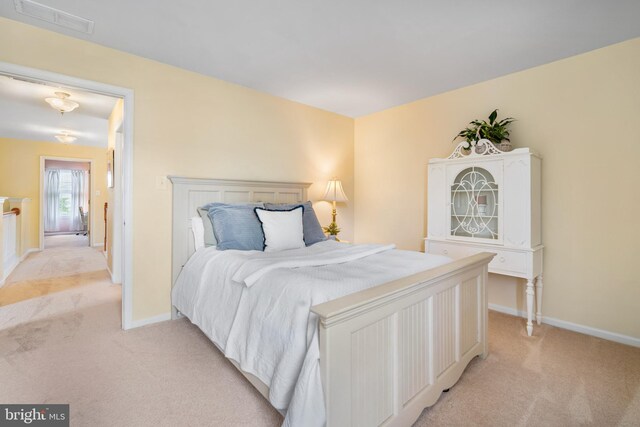 129 Bridle Path Dr, Egg Harbor Township, NJ 08234 - bedroom with light carpet and baseboards