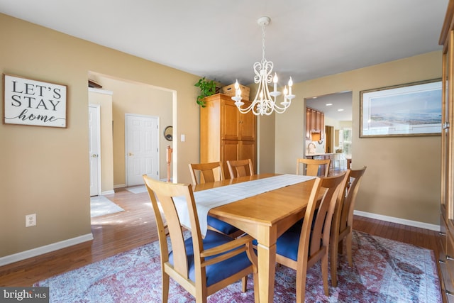 129 Bridle Path Dr, Egg Harbor Township, NJ 08234 - dining space featuring a chandelier, light wood-type flooring, and baseboards