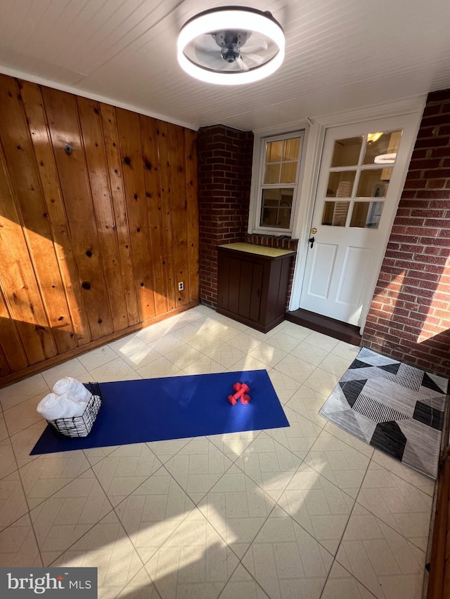 2108 26th St S, Arlington, VA 22206 - exercise room featuring wood walls and brick wall