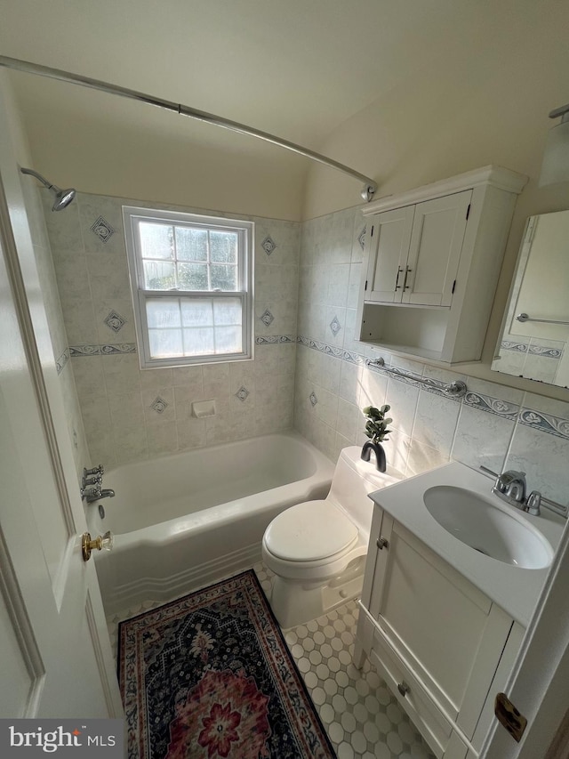 2108 26th St S, Arlington, VA 22206 - bathroom featuring shower / washtub combination, vanity, tile walls, and tile patterned flooring