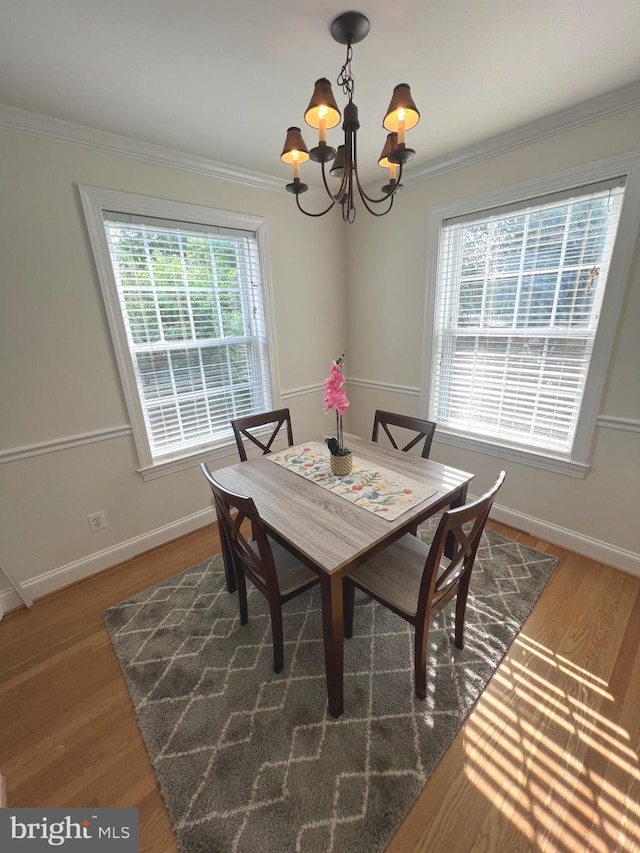 2108 26th St S, Arlington, VA 22206 - dining room featuring a chandelier, crown molding, and wood finished floors