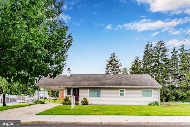 524 S Pitt St, Carlisle, PA 17013 - ranch-style home with a front yard, concrete driveway, an attached carport, and a chimney