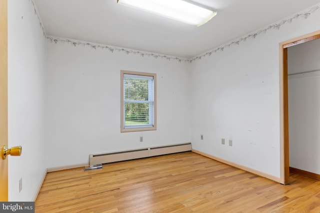 524 S Pitt St, Carlisle, PA 17013 - unfurnished bedroom with baseboard heating, light wood finished floors, and baseboards