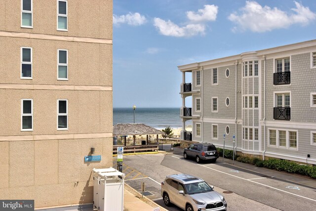 3 Laurel St, Rehoboth Beach, DE 19971 - view of building exterior with a water view and uncovered parking