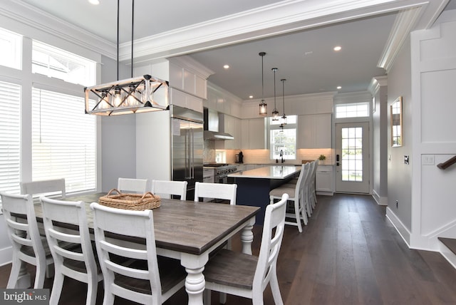 3 Laurel St, Rehoboth Beach, DE 19971 - dining room with a chandelier, dark wood-type flooring, recessed lighting, ornamental molding, and baseboards