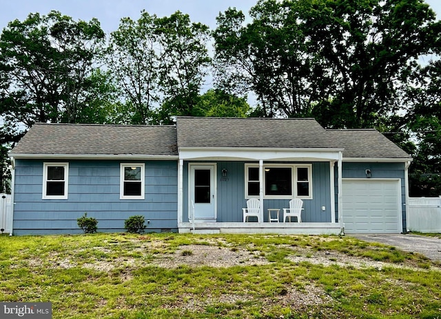1027 Windlass Dr, Manahawkin, NJ 08050 - ranch-style home featuring a porch, a garage, board and batten siding, and a shingled roof
