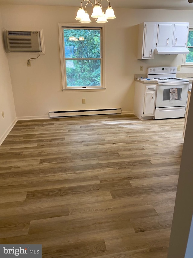 204 Marion Ave, Carlisle, PA 17013 - unfurnished dining area featuring a baseboard heating unit, a chandelier, light wood-type flooring, a wall unit AC, and baseboards