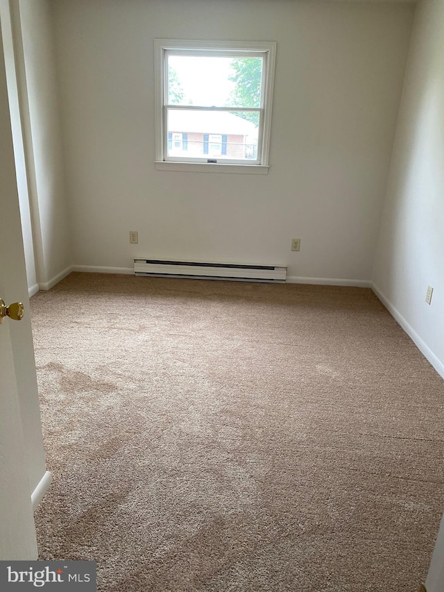 204 Marion Ave, Carlisle, PA 17013 - unfurnished room featuring carpet, a baseboard heating unit, and baseboards