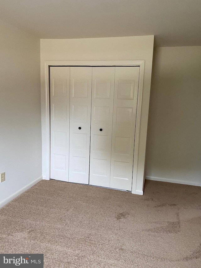 204 Marion Ave, Carlisle, PA 17013 - unfurnished bedroom featuring carpet flooring, a closet, and baseboards