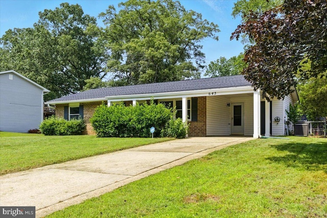 643 University Dr, Waldorf, MD 20602 - ranch-style home featuring brick siding, concrete driveway, a front yard, and a carport