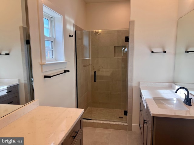 34232 Brenner Ln, Lewes, DE 19958 - full bathroom with two vanities, a stall shower, and tile patterned floors