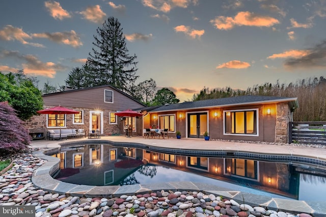 2539 Aquetong Rd, New Hope, PA 18938 - rear view of property featuring a patio area, an outdoor pool, and stone siding