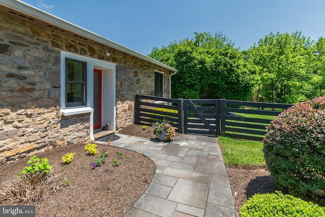 2539 Aquetong Rd, New Hope, PA 18938 - view of exterior entry with stone siding and a gate