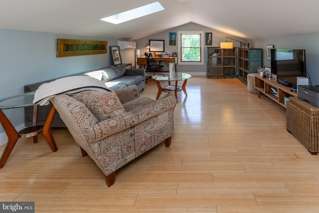2539 Aquetong Rd, New Hope, PA 18938 - living area featuring a skylight, light wood-style flooring, lofted ceiling, a wall mounted AC, and an office area
