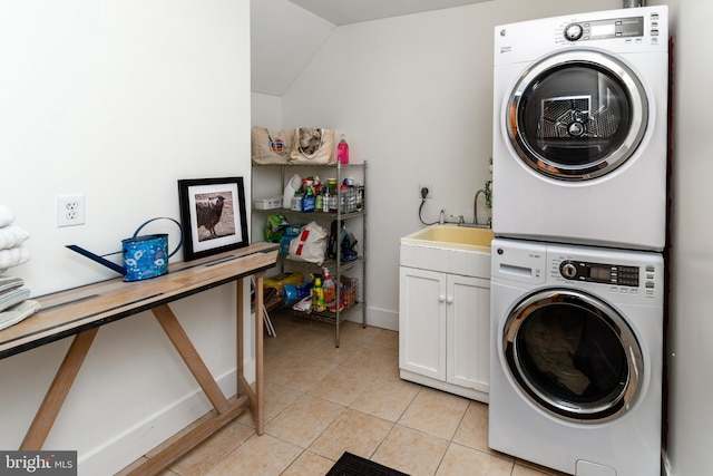 2539 Aquetong Rd, New Hope, PA 18938 - laundry room featuring stacked washer / dryer, cabinet space, light tile patterned flooring, and baseboards