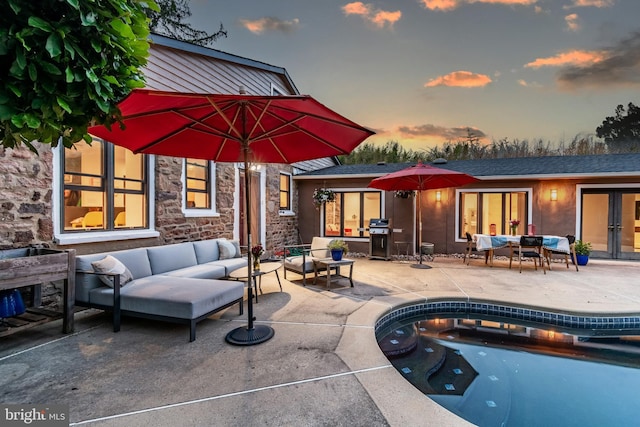 2539 Aquetong Rd, New Hope, PA 18938 - pool at dusk with an outdoor hangout area, french doors, a patio area, grilling area, and an outdoor pool