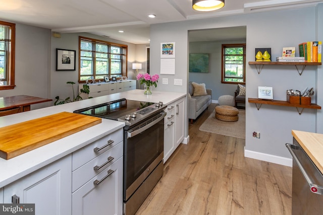 2539 Aquetong Rd, New Hope, PA 18938 - kitchen with appliances with stainless steel finishes, light wood finished floors, white cabinetry, baseboards, and open shelves