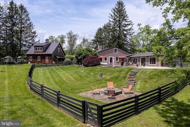 2539 Aquetong Rd, New Hope, PA 18938 - view of front of home featuring an outdoor fire pit, a chimney, a patio, and metal roof