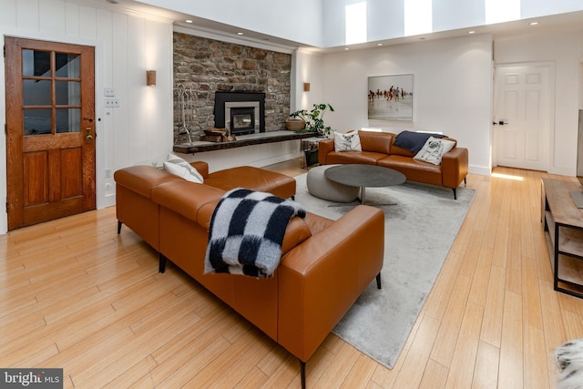 2539 Aquetong Rd, New Hope, PA 18938 - living area with light wood-style flooring, recessed lighting, a stone fireplace, and a high ceiling
