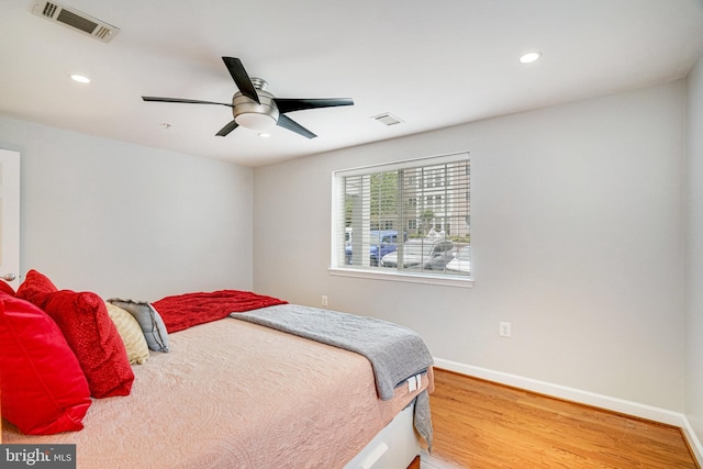 4149 S Four Mile Run Dr Unit 201, Arlington, VA 22204 - bedroom with wood finished floors, recessed lighting, baseboards, and ceiling fan