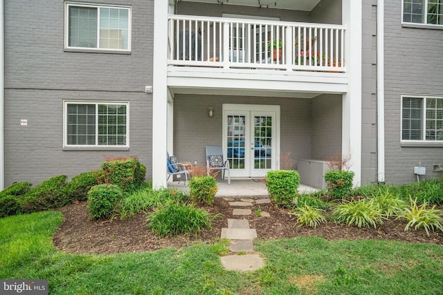 4149 S Four Mile Run Dr Unit 201, Arlington, VA 22204 - entrance to property featuring brick siding, french doors, and a balcony