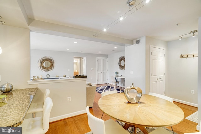 4149 S Four Mile Run Dr Unit 201, Arlington, VA 22204 - dining area featuring light wood finished floors, baseboards, recessed lighting, and track lighting