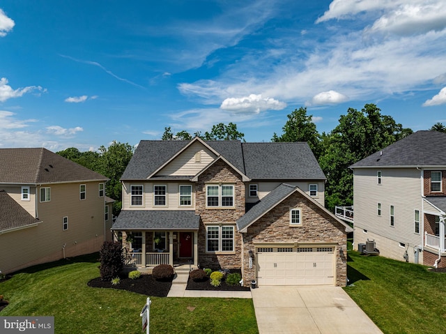1509 Blakes Legacy Dr, Bel Air, MD 21014 - craftsman house featuring a porch, stone siding, a front lawn, and driveway