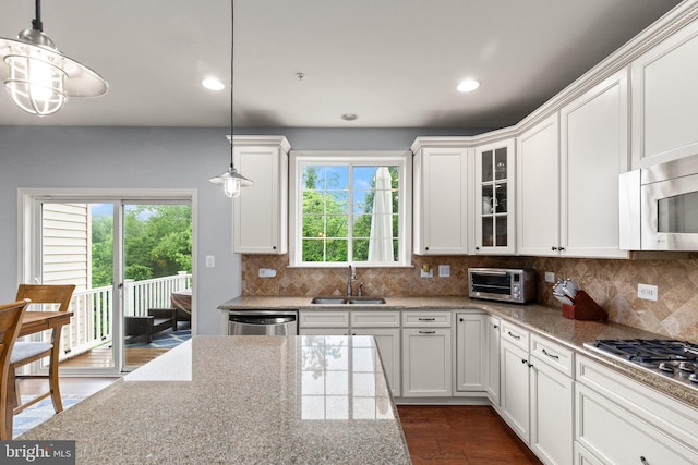 1509 Blakes Legacy Dr, Bel Air, MD 21014 - kitchen featuring stainless steel appliances, white cabinets, glass insert cabinets, tasteful backsplash, and recessed lighting