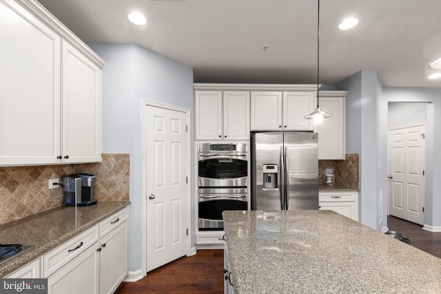 1509 Blakes Legacy Dr, Bel Air, MD 21014 - kitchen with appliances with stainless steel finishes, white cabinets, dark wood finished floors, light stone counters, and recessed lighting