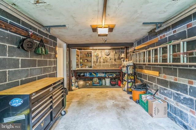 622 Hutchinson Ter, Holmes, PA 19043 - garage with concrete block wall and a garage door opener