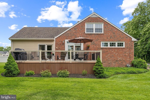 622 Hutchinson Ter, Holmes, PA 19043 - rear view of property featuring brick siding, a wooden deck, a lawn, and a shingled roof