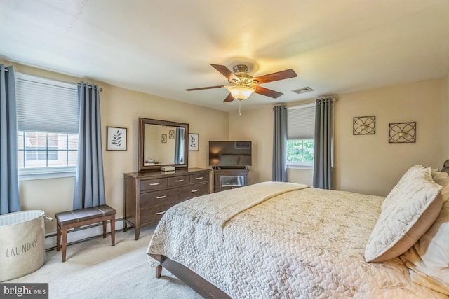 622 Hutchinson Ter, Holmes, PA 19043 - bedroom with baseboard heating, light carpet, and a ceiling fan