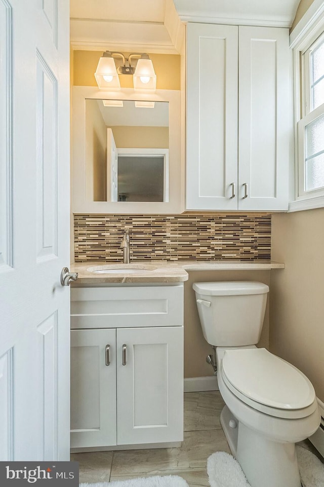 622 Hutchinson Ter, Holmes, PA 19043 - bathroom with vanity, backsplash, and wood finished floors