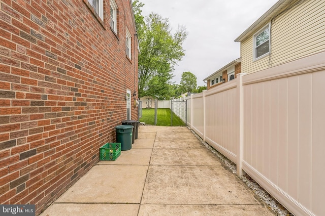 622 Hutchinson Ter, Holmes, PA 19043 - view of side of home featuring brick siding and a patio area