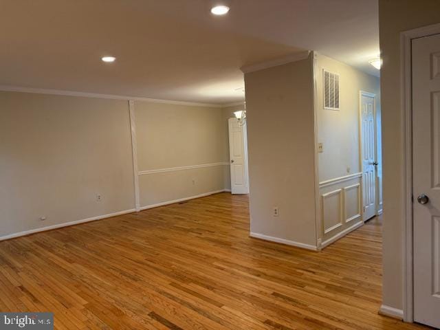 10024 Park Woods Ln, Burke, VA 22015 - spare room with ornamental molding, baseboards, wood finished floors, a chandelier, and recessed lighting