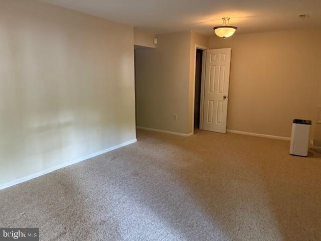 10024 Park Woods Ln, Burke, VA 22015 - carpeted spare room with baseboards
