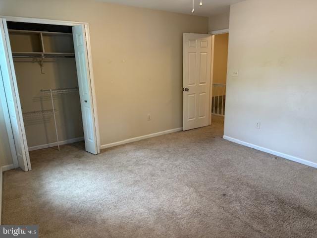 10024 Park Woods Ln, Burke, VA 22015 - unfurnished bedroom featuring baseboards, carpet floors, and a closet