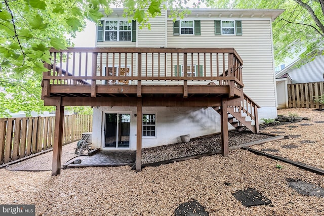10024 Park Woods Ln, Burke, VA 22015 - back of house featuring a fenced backyard, a deck, and a patio