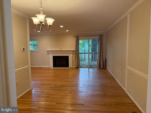 10024 Park Woods Ln, Burke, VA 22015 - unfurnished living room featuring ornamental molding, healthy amount of natural light, wood finished floors, and recessed lighting
